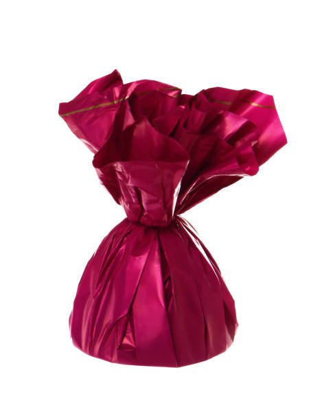 istock Delicious candy in pink wrapper isolated on white 1404024302