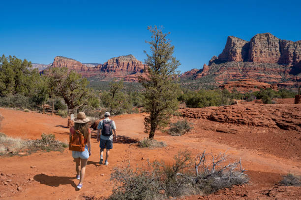 istock Couple on spring hiking trip in red mountains. 1404025687