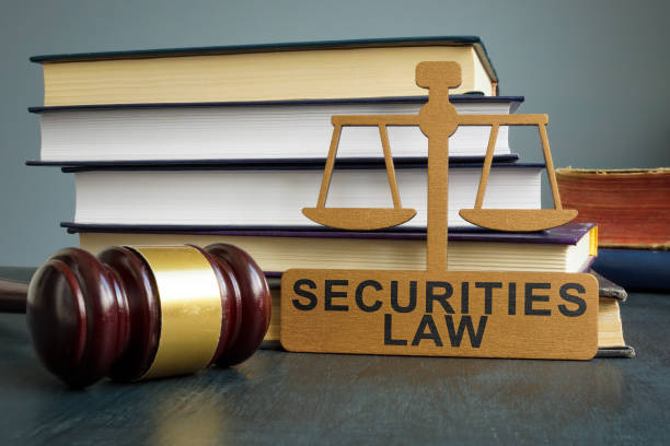 istock Securities law tablet, gavel and stack of books. 1404029718