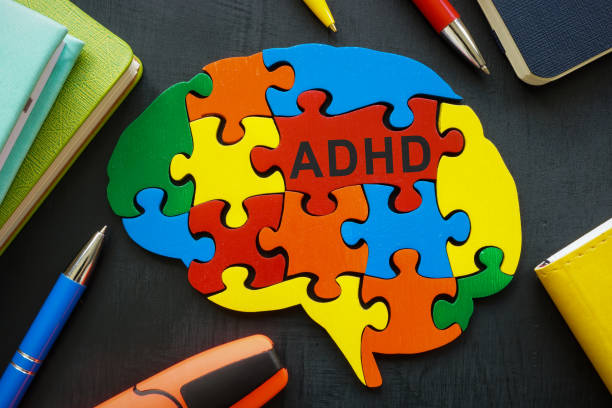 istock Brain made of colored pieces with the inscription ADHD. 1404029828
