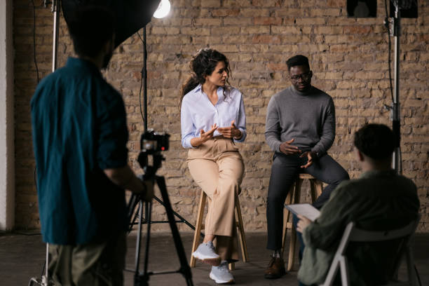 istock Journalist interviewing diverse group of actors in a studio 1404029917