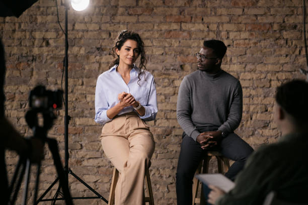 istock Journalist interviewing diverse group of actors in a studio 1404029918