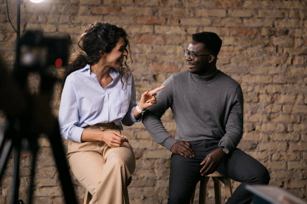 istock Diverse couple of models giving an interview in a studio 1404029924