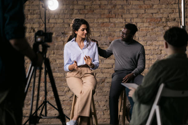 istock Journalist interviewing diverse group of actors in a studio 1404029975