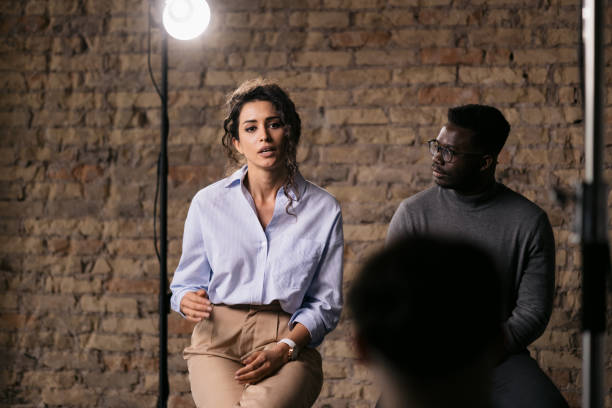 istock Journalist interviewing diverse group of actors in a studio 1404029987