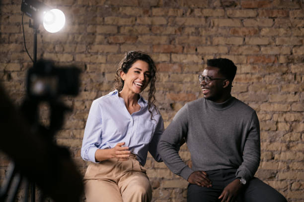 istock Diverse couple of models giving an interview in a studio 1404029991