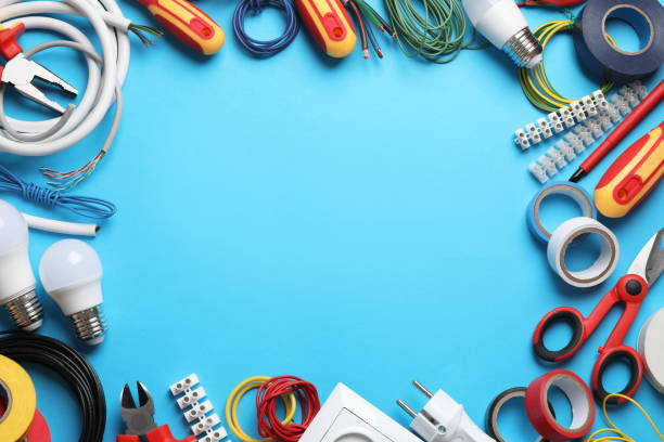 istock Frame of electrician's tools and accessories on light blue background, flat lay. Space for text 1404030088
