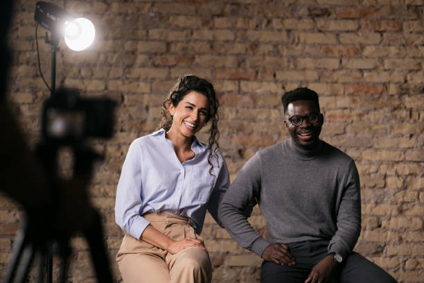 istock Diverse couple of models giving an interview in a studio 1404030266