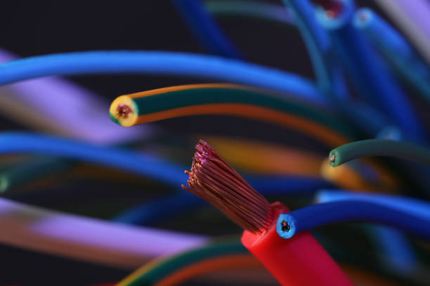 istock Colorful cables on blurred background, closeup. Electrician's supply 1404030350