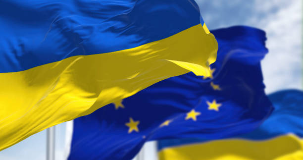 the national flag of Ukraine waving with blurred european union flag on a clear day the national flag of Sweden waving with blurred european union flag on a clear day. Democracy and politics. ukraine flag stock pictures, royalty-free photos & images