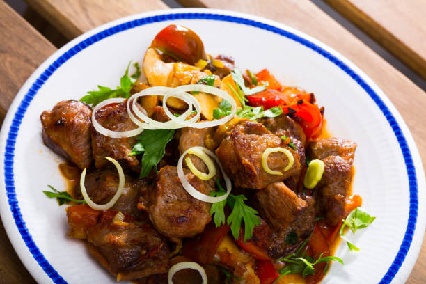 istock Meat baked with mushrooms and vegetables 1404031246