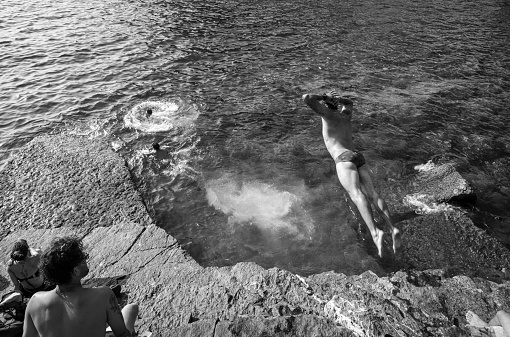 Accra, Ghana - 1958: People swimming in a saltwater pool on the coast at Teshie in Accra, Ghana c.1958