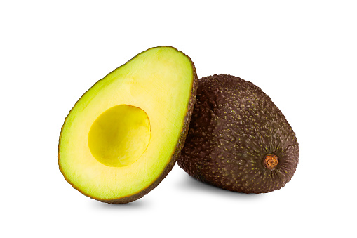 Isolated avocado hass cut and whole on a white background
