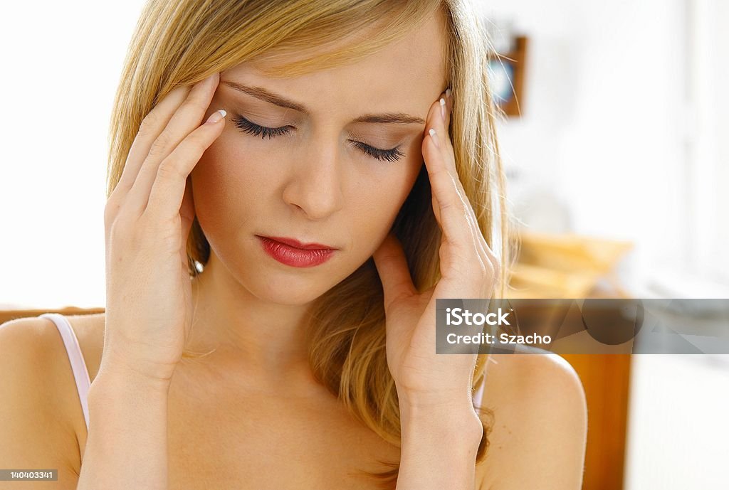 headache blond young woman and headache Adult Stock Photo