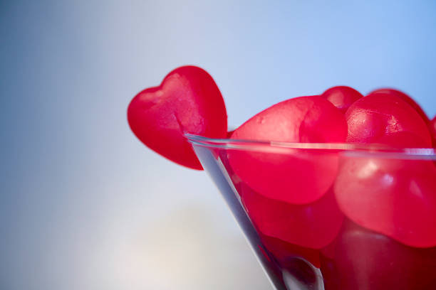 Candy hearts in martini glass stock photo