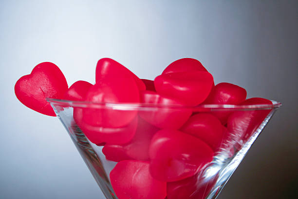 Candy hearts in martini glass stock photo