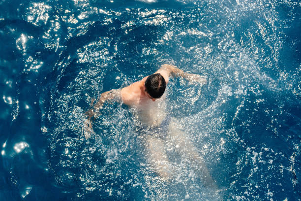 Man swims in the sea