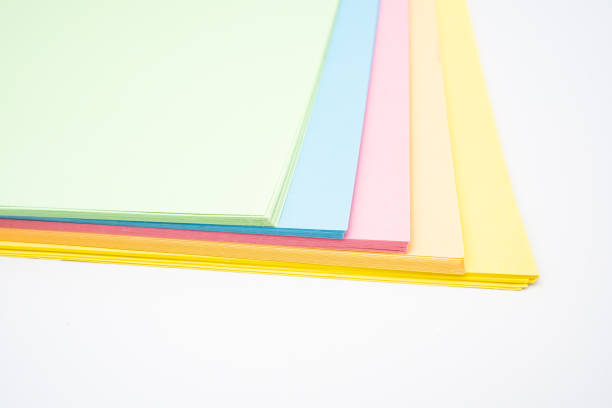 istock Abstract background with rainbow colored paper, white background, pastel shades 1404036249