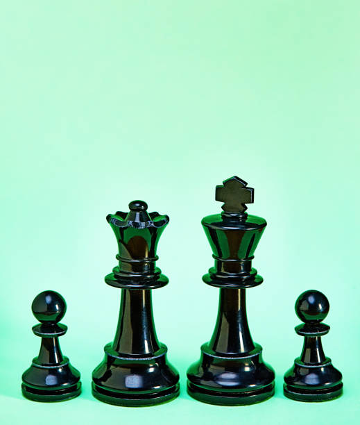 Large and small chess pieces represented mother, father and two children.