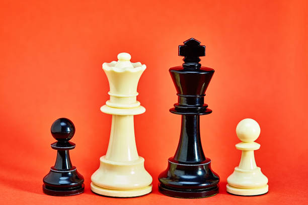 istock Chess king, queen and pawns represent a multiracial blended family 1404037676
