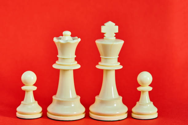 istock Chess king, queen and pawns represent a family 1404037771