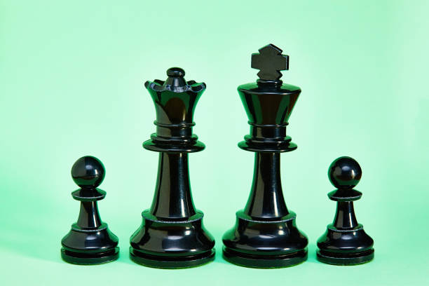 Large and small chess pieces represented mother, father and two children.