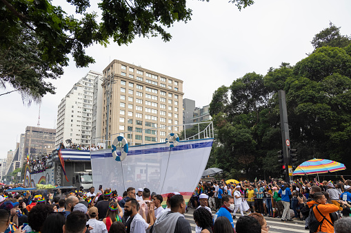 São Paulo, SP, Brazil, JUN 19, 2022: Personalities parade in a sound car on Paulista avenue the 26th Gay Pride Parade, celebration of LGBTQIA+ Pride