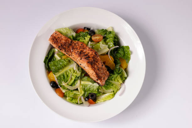 Healthy BLACKENED SALMON SALAD in a dish top view on grey background singapore food stock photo