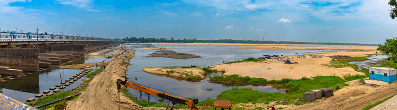 Durgapur, West Bengal, India. June 18,2022.  Panoramic View of Durgapur Barrage and Machineries with workers at the time of Log Sluice Gate Repair with Fishermen on the other side.