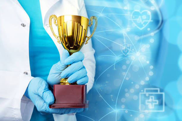 world medical award, golden cup in doctor's hands on background of planet with international connections,healthcare and medicine,Element of the image provided by NASA stock photo