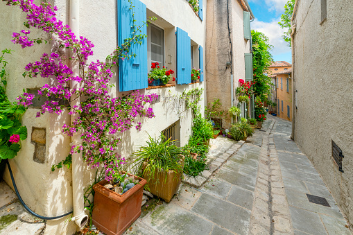 Traditional, charming streets in the medieval village of Grimaud, France, in the hills above Saint-Tropez along the French Riviera.