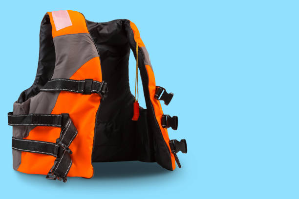 istock orange life jacket with gray inserts, on cyan background, concept 1404043129