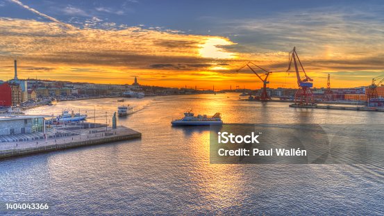 istock Focus on ferry driving towards the pier and station named "Stenpiren" in central Gothenburg, Sweden. 1404043366