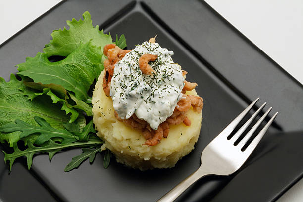 Mashed potatoes with shrimps and creamy cheese stock photo