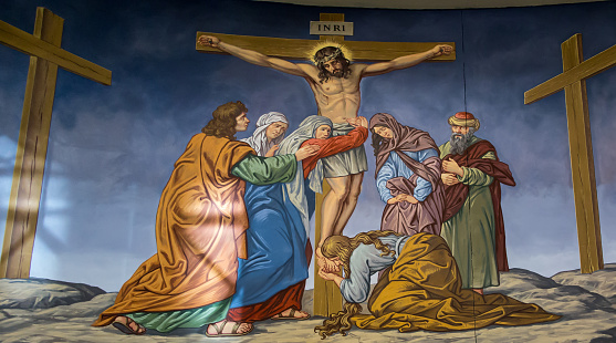 Torun, Poland, May 10, 2022: Inside the Sanctuary of the Blessed Virgin Mary, Star of the New Evangelization and St. John Paul II in Torun. A painting depicting the crucifixion of Jesus.