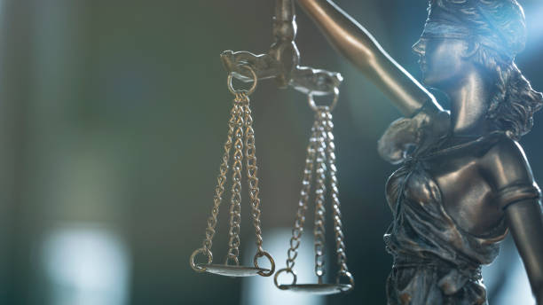 istock Statue of justice blindfolded lady holding scales and sword 1404045014