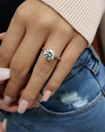 luxury diamond rings on woman fingers