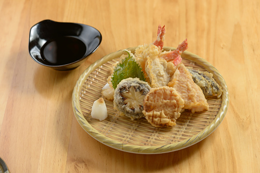 japanese food Tempura Moriawase in a wooden plate isolated on wooden table top view