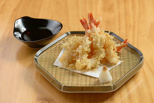 japanese food Deep Fried ebi tempura shrimp in a tray with chili sauce on wooden background top view