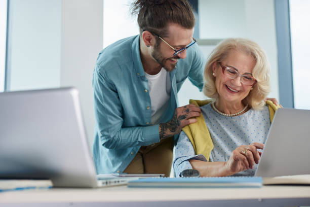 istock An educator helping female senior student to master the material. 1404048256