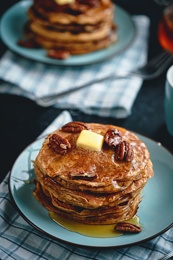 Pancakes with Butter, Pecans and Maple Syrup
