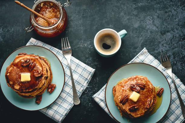 Pancakes with Butter, Pecans and Maple Syrup