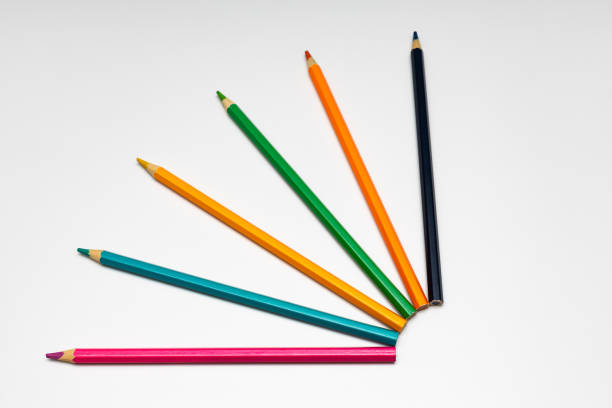 istock colored pencils lie on a white background 1404049791