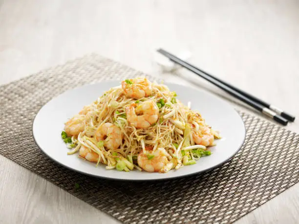 Stewed Vermicelli with Crystal Prawn Sauce with chopsticks served in a dish isolated on mat side view on grey background