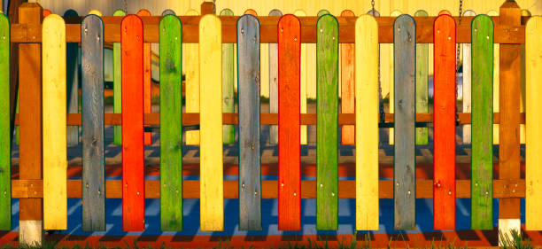 istock Multicolored wooden fence, close-up front view. 1404053775
