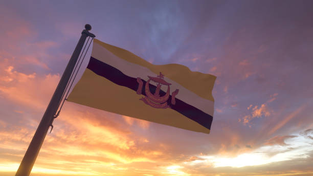 イブニングサンセットスカイの旗竿のブルネイフラッグ - brunei flag ストックフォトと画像