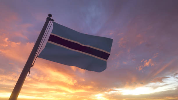 Botswana Flag on Flagpole by Evening Sunset Sky stock photo