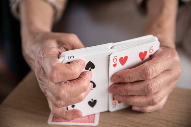 Woman Hands Mixing Playing Cards Close Up stock photo