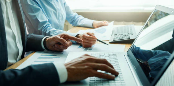 istock businessman team working in office. discussing and analyzing business financial data. investment strategy 1404061017