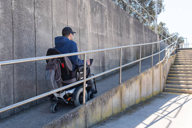 istock Man on a wheelchair on ramp. 1404061369